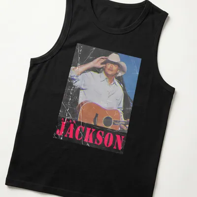 Vintage distressed t-shirt featuring Alan Jackson with guitar graphic — printed on a tank top