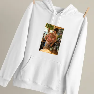 Photographic Aloha Barista t-shirt with a cheerful coffee maker in aloha — printed on a unisex hoodie