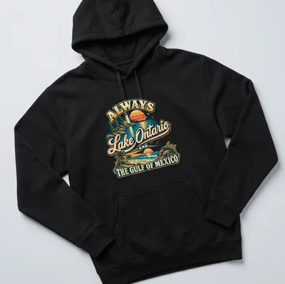 Vintage-style t-shirt featuring a lighthouse and coastal view with colorful retro design. — printed on a unisex hoodie