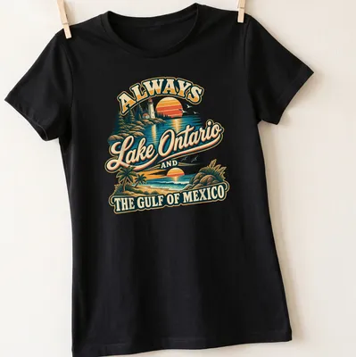 Vintage-style t-shirt featuring a lighthouse and coastal view with colorful retro design. — printed on a women's shirt