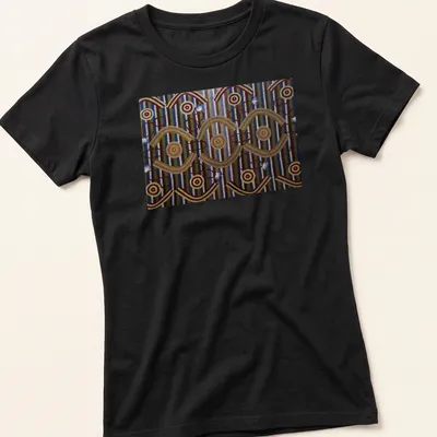 Ceremonial designs with text representing Anmatyerre culture in vibrant colors. — printed on a women's shirt