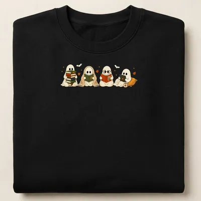 Kawaii illustration of two ghosts reading books among autumn leaves — printed on a unisex sweatshirt
