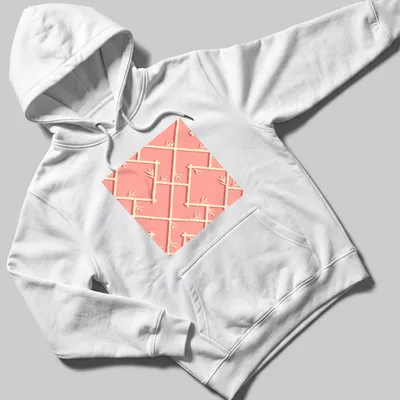 Chinoiserie bamboo lattice pattern in peach, coral, and cream shades — printed on a unisex hoodie