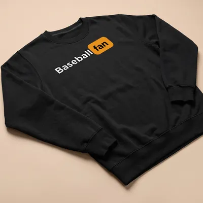 Bold typography shirt stating 'Baseball fan' in black and orange. — printed on a unisex sweatshirt
