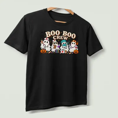 Kawaii cartoon of ghost nurses with text 'BOO BOO CREW' in vibrant colors — printed on a unisex t-shirt (angled view)