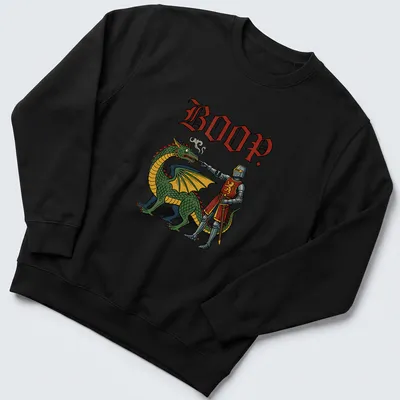 Colorful cartoon t-shirt featuring a playful dragon and the word 'BOOP.' — printed on a unisex sweatshirt