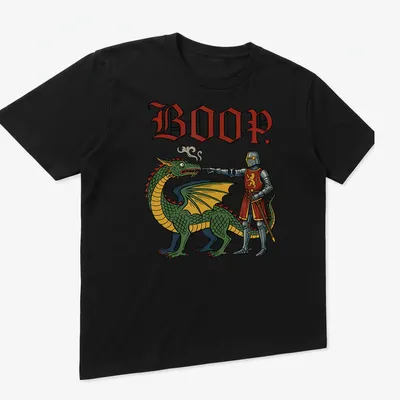 Colorful cartoon t-shirt featuring a playful dragon and the word 'BOOP.' — printed on a unisex t-shirt (angled view)