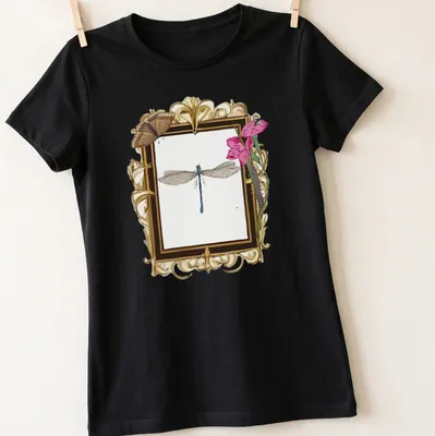 Vintage botanical-style t-shirt featuring a dragonfly in soft colors — printed on a women's shirt
