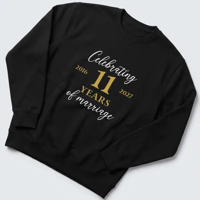 Elegant t-shirt celebrating 11 years of marriage with gold and white lettering. — printed on a unisex sweatshirt