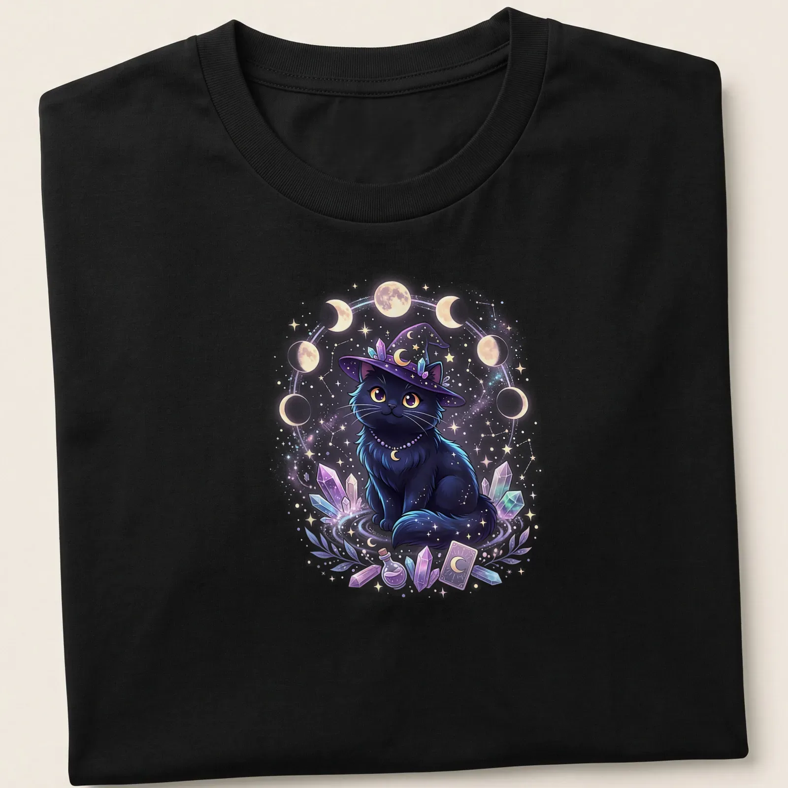Kawaii black cat wearing a witch hat with moon cycles in pastel colors — printed on a unisex t-shirt