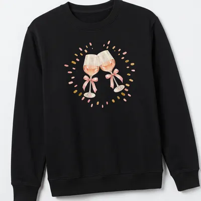 Watercolor design of two pink wine glasses clinking against a white background — printed on a unisex sweatshirt
