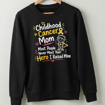 Cartoon superhero boy with text celebrating childhood cancer moms — printed on a unisex sweatshirt