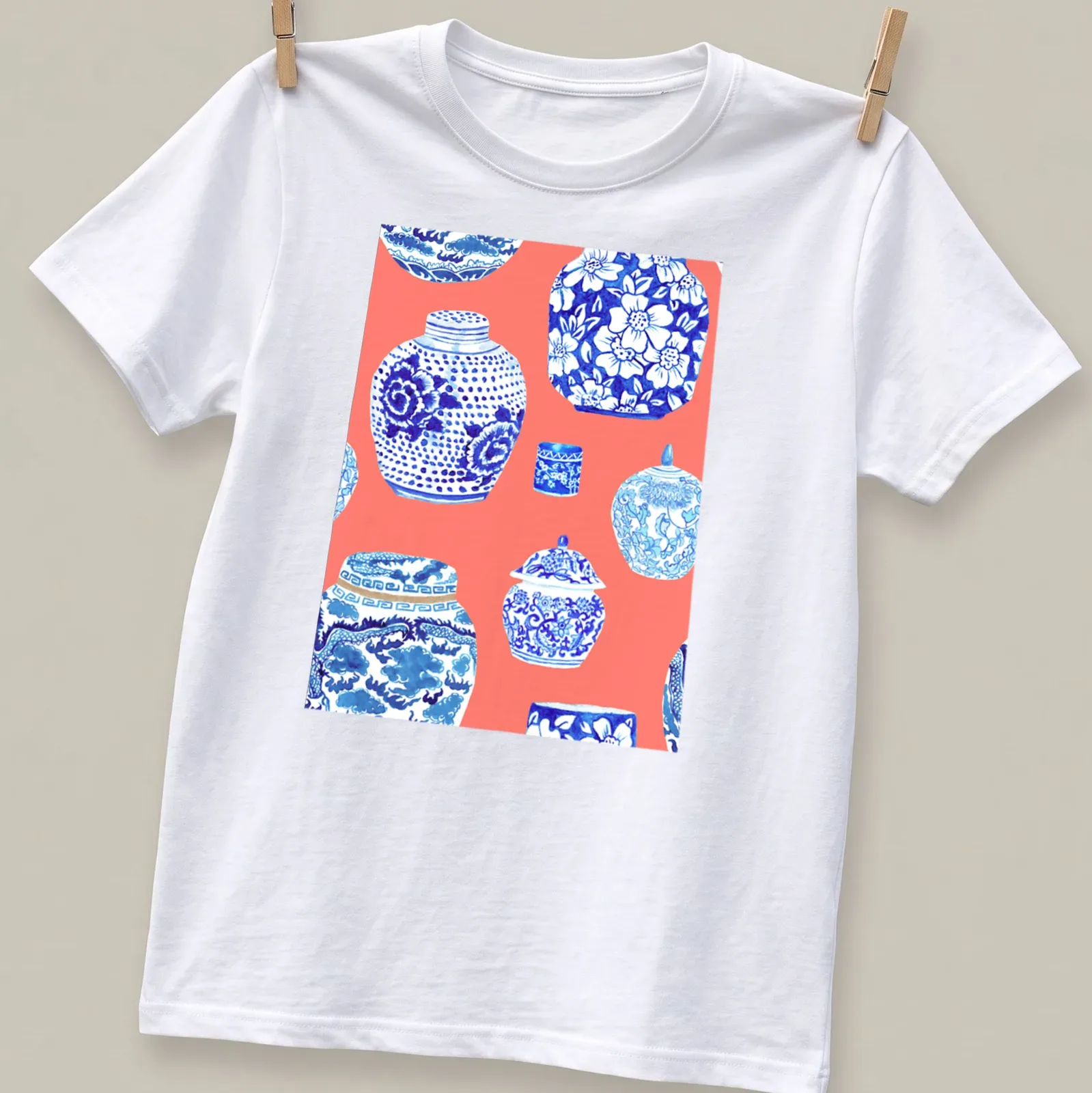 Watercolor design of ginger jars in neon peach, coral, blue, and white. — printed on a unisex t-shirt