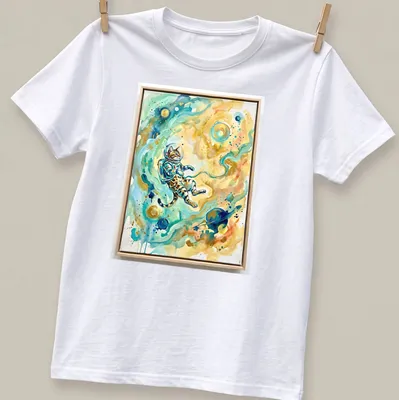Watercolor print of a Bengal cat in an astronaut suit against a cosmic background — printed on a unisex t-shirt