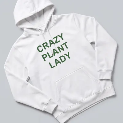 Bold typography CRAZY PLANT LADY shirt with green text on white background — printed on a unisex hoodie