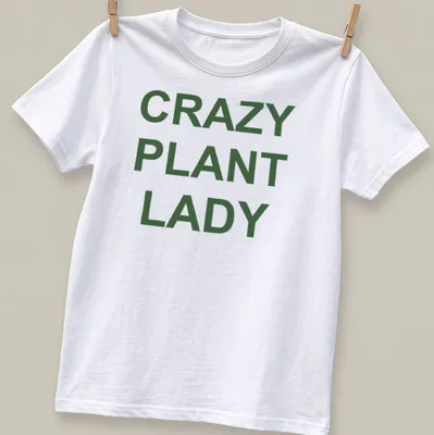 Bold typography CRAZY PLANT LADY shirt with green text on white background
