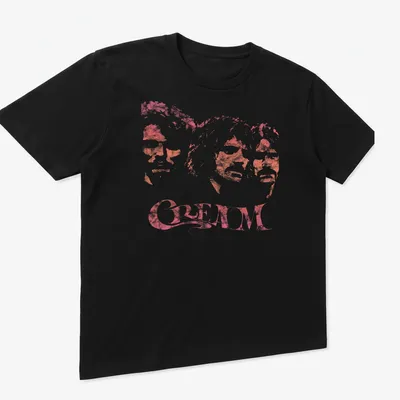 Three member portraits of the band CREAM in pink-tinted style — printed on a unisex t-shirt (angled view)