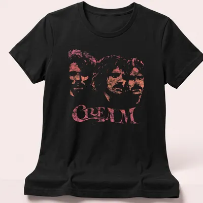 Three member portraits of the band CREAM in pink-tinted style — printed on a women's shirt