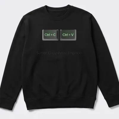 Typography shirt with printed text "Senior Copy-Paste Engineer Ctrl + C Ctrl + V" — printed on a unisex sweatshirt