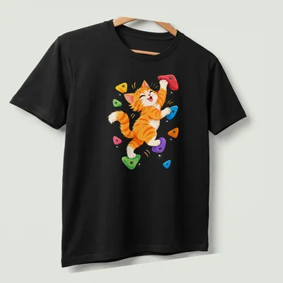 Kawaii illustration of an orange tabby kitten rock climbing in vibrant colors — printed on a unisex t-shirt (angled view)