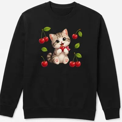 Kawaii kitten eating a red cherry, with playful text in a cute font. — printed on a unisex sweatshirt