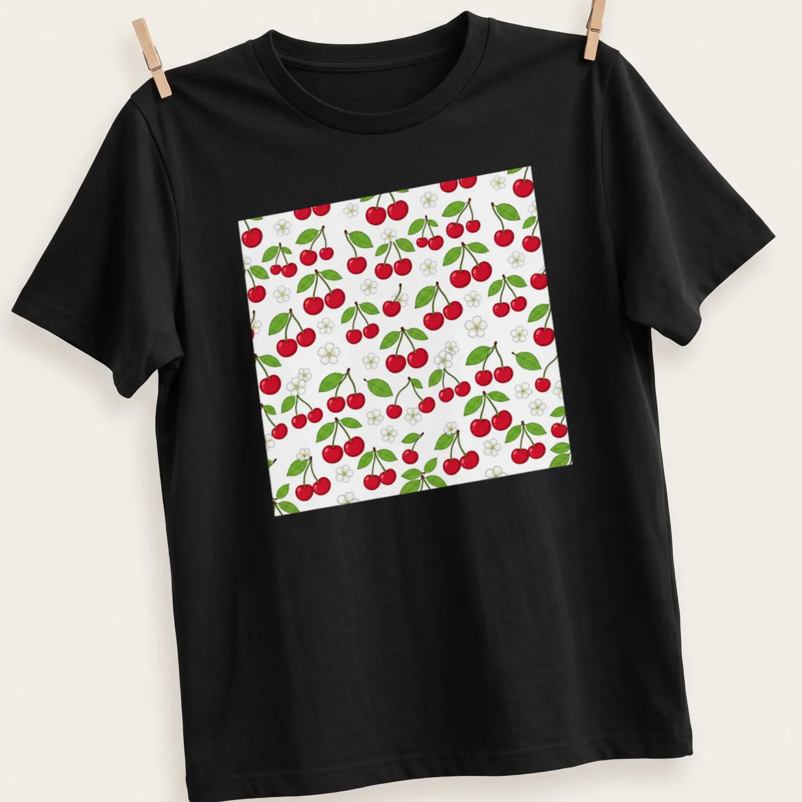 Illustration of red cherries on a botanical pattern in green and white — printed on a unisex t-shirt