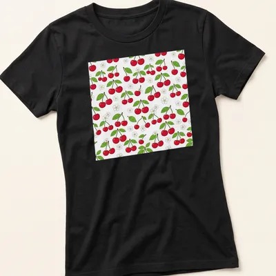 Illustration of red cherries on a botanical pattern in green and white — printed on a women's shirt