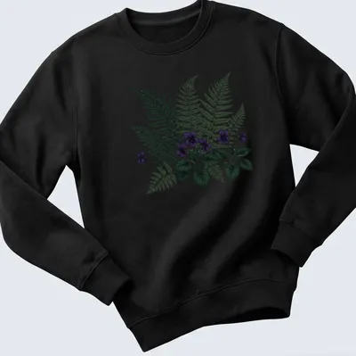 Moody botanical print featuring purple violets and ferns with elegant text. — printed on a unisex sweatshirt