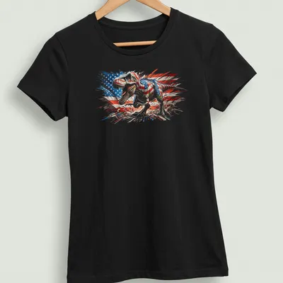 Distressed T-Rex graphic with American flag elements, celebrating July 4th — printed on a women's shirt