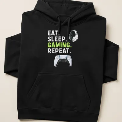 Bold gaming tee with graphic text 'Eat Sleep Gaming Repeat' and controller design — printed on a unisex hoodie