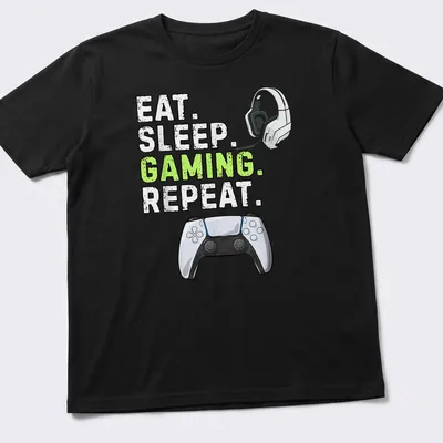 Bold gaming tee with graphic text 'Eat Sleep Gaming Repeat' and controller design