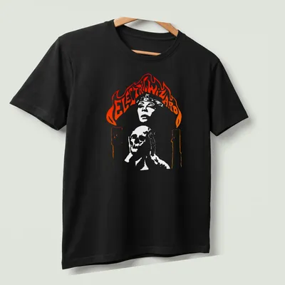 Electric Wizard t-shirt featuring a skull with candles and flames in bold colors — printed on a unisex t-shirt (angled view)
