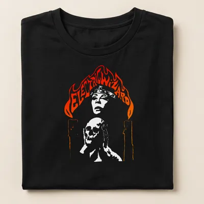 Electric Wizard t-shirt featuring a skull with candles and flames in bold colors — printed on a women's shirt
