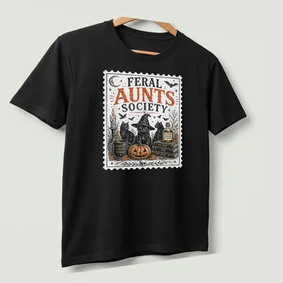 Vintage stamp print featuring three black cats in witch hats. — printed on a unisex t-shirt (angled view)