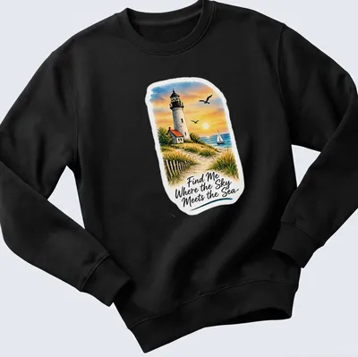 Vibrant landscape of a lighthouse with the quote about the sea and sky — printed on a unisex sweatshirt