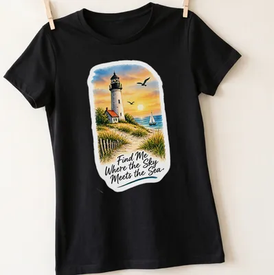 Vibrant landscape of a lighthouse with the quote about the sea and sky — printed on a women's shirt