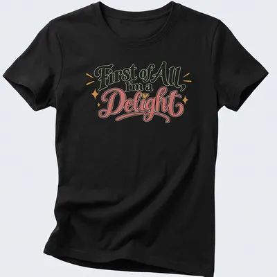 Playful retro shirt with decorative text and stars in black, pink, gold, and white — printed on a women's shirt