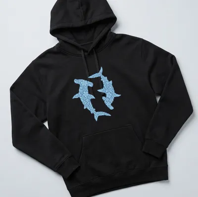 Illustration of floral hammerhead sharks in light and dark blue with white accents — printed on a unisex hoodie