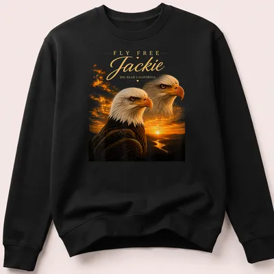 Realistic print of a Bald Eagle in flight with text FLY FREE Jackie BIG BEAR CALIFORNIA — printed on a unisex sweatshirt