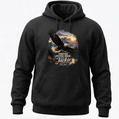 Realistic Bald Eagle soaring against a sunset with text Forever Flying High Jackie 2012 - 2026 — printed on a unisex hoodie
