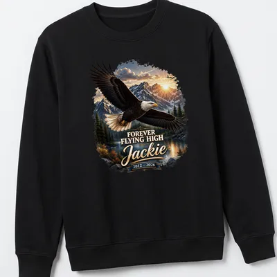 Realistic Bald Eagle soaring against a sunset with text Forever Flying High Jackie 2012 - 2026 — printed on a unisex sweatshirt