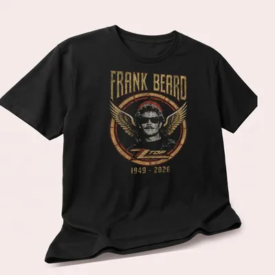 Vintage retro tribute to Frank Beard with bold text and rock colors — printed on a unisex t-shirt (angled view)