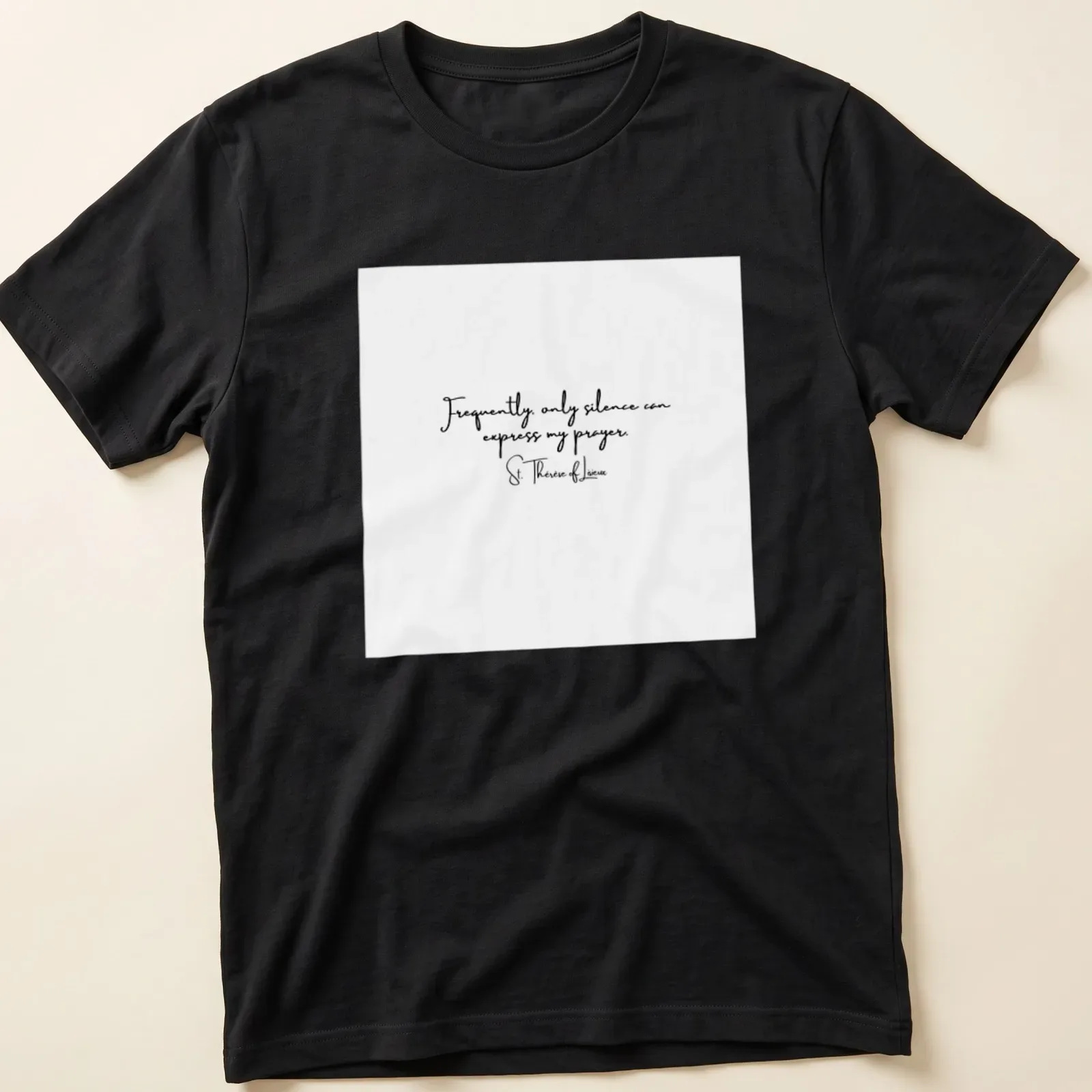 Elegant script T-shirt with St. Therese of Lisieux quote about silence in prayer — printed on a unisex t-shirt