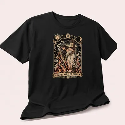 Vintage tarot card design featuring a witch with the phrase 'Girls Will Be Girls' in cream and red. — printed on a unisex t-shirt (angled view)