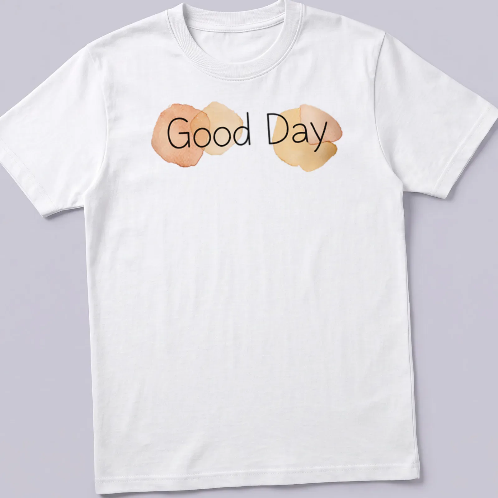Minimalist t-shirt featuring watercolor circles and the words Good Day in soft colors — printed on a unisex t-shirt