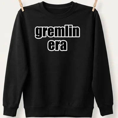 Bold text t-shirt featuring the phrase 'gremlin era' in black and white — printed on a unisex sweatshirt