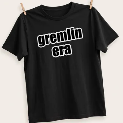 Bold text t-shirt featuring the phrase 'gremlin era' in black and white — printed on a unisex t-shirt