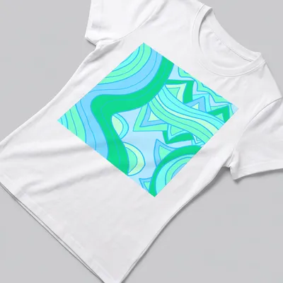 Modern geometric design of abstract waves in blue and green tones. — printed on a women's shirt