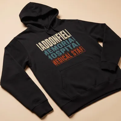 Vintage distressed Haddonfield Memorial Hospital Medical Staff t-shirt with color details — printed on a unisex hoodie