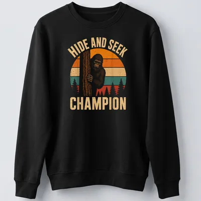 Retro vintage Bigfoot Sasquatch t-shirt with playful text above cartoon art — printed on a unisex sweatshirt